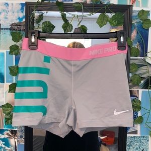 Gray, pink, and green Nike pro shorts. Size M.